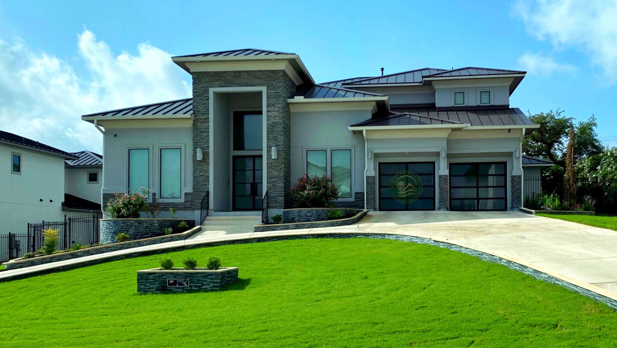 A mansion with a beautiful luxurious landscaping and grass
